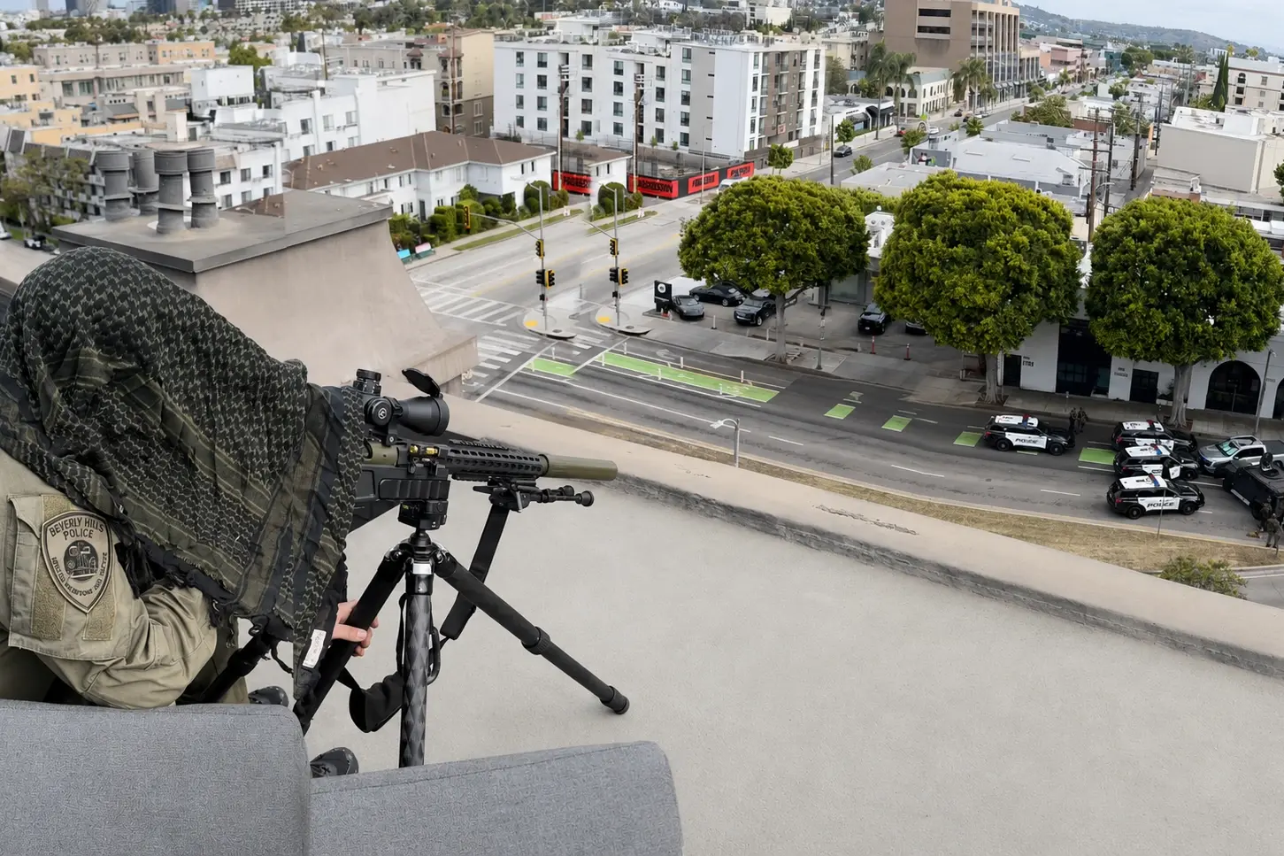 A BHPD SWAT sniper provides overwatch as law enforcement surrounds a gray Ford pickup near Burton Way and Robertson Boulevard after an ALPR alert led Beverly Hills police to a wanted felony vehicle.