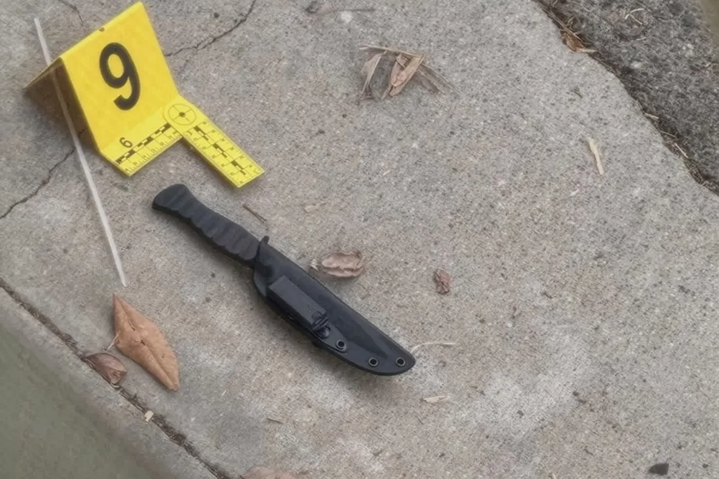 A knife believed to have been used in the fatal confrontation lies beside evidence marker No. 9 as police investigate the scene in Beverly Hills on Sunday, August 30, 2026.