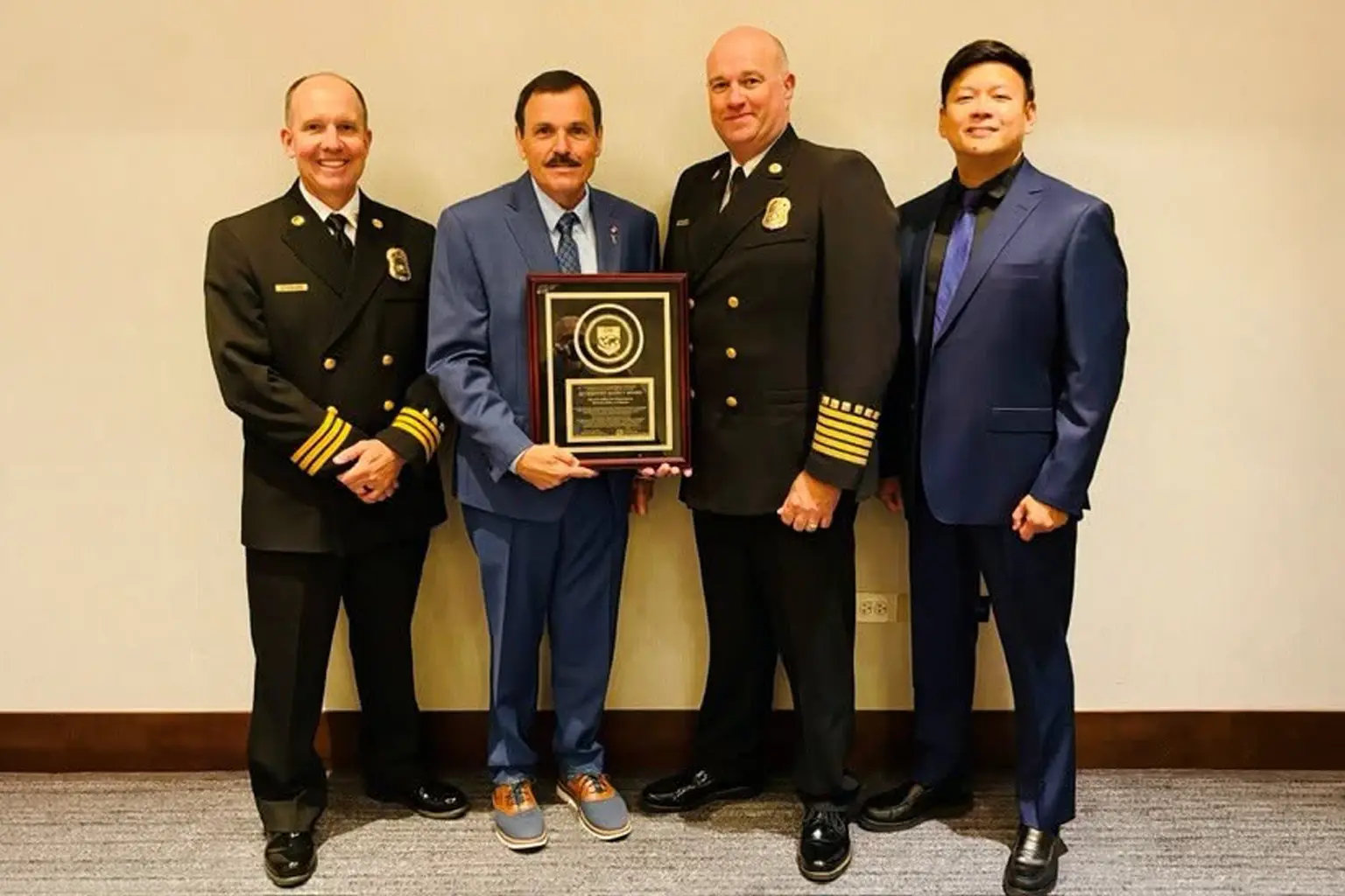 Beverly Hills Fire Department representatives display an accreditation plaque. The city announced BHFD's international reaccreditation on September 3.