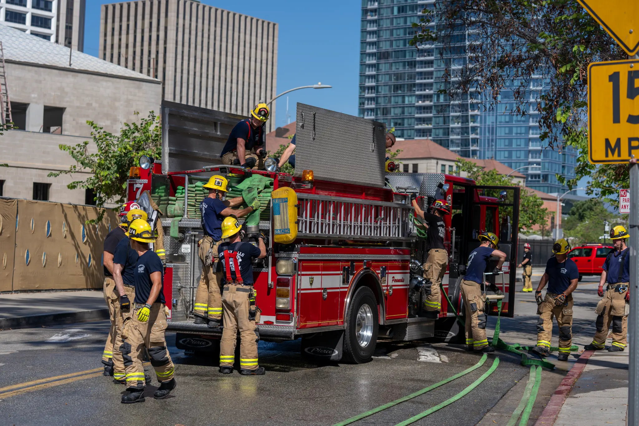 Beverly Hills firefighters deploy hoses and prepare equipment during an emergency response exercise at BHUSD’s Lasky Building.