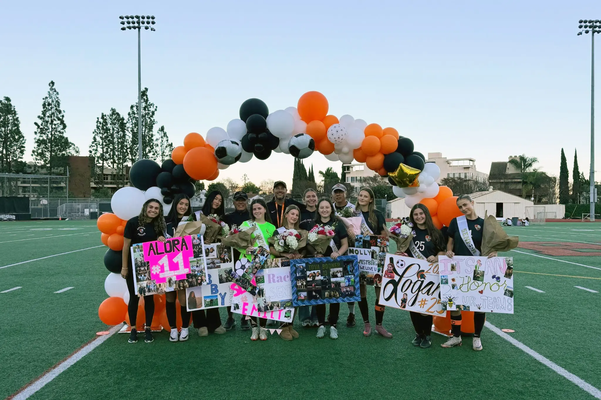BHHS Girls Varsity Soccer seniors stand with their coaches under the Senior Night arch during a special ceremony on January 16, 2026