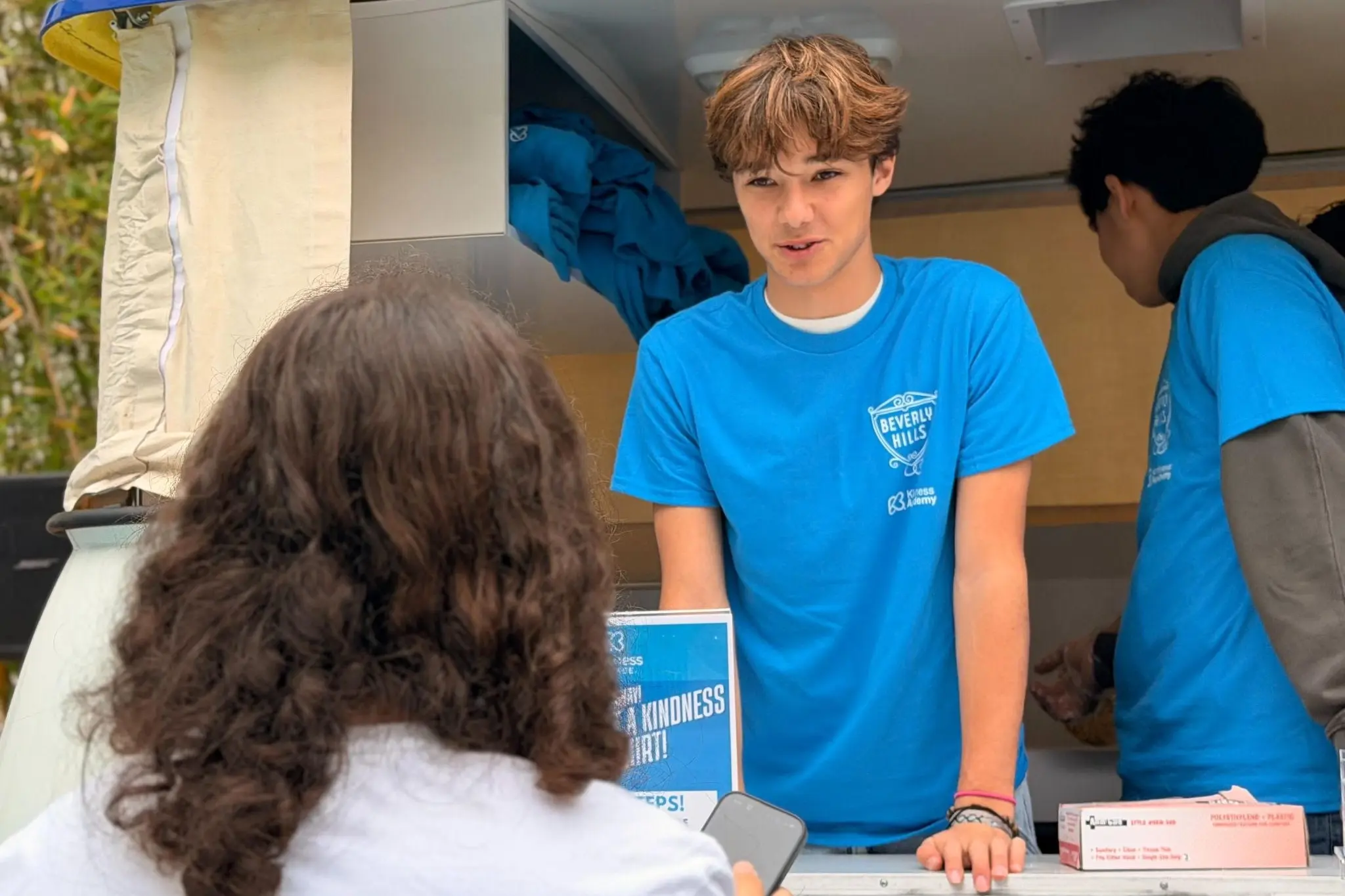 BHHS student volunteer connects with a peer during Kindness Week at Beverly Hills High School, supporting student-led efforts to promote empathy, kindness, and community across campus.
