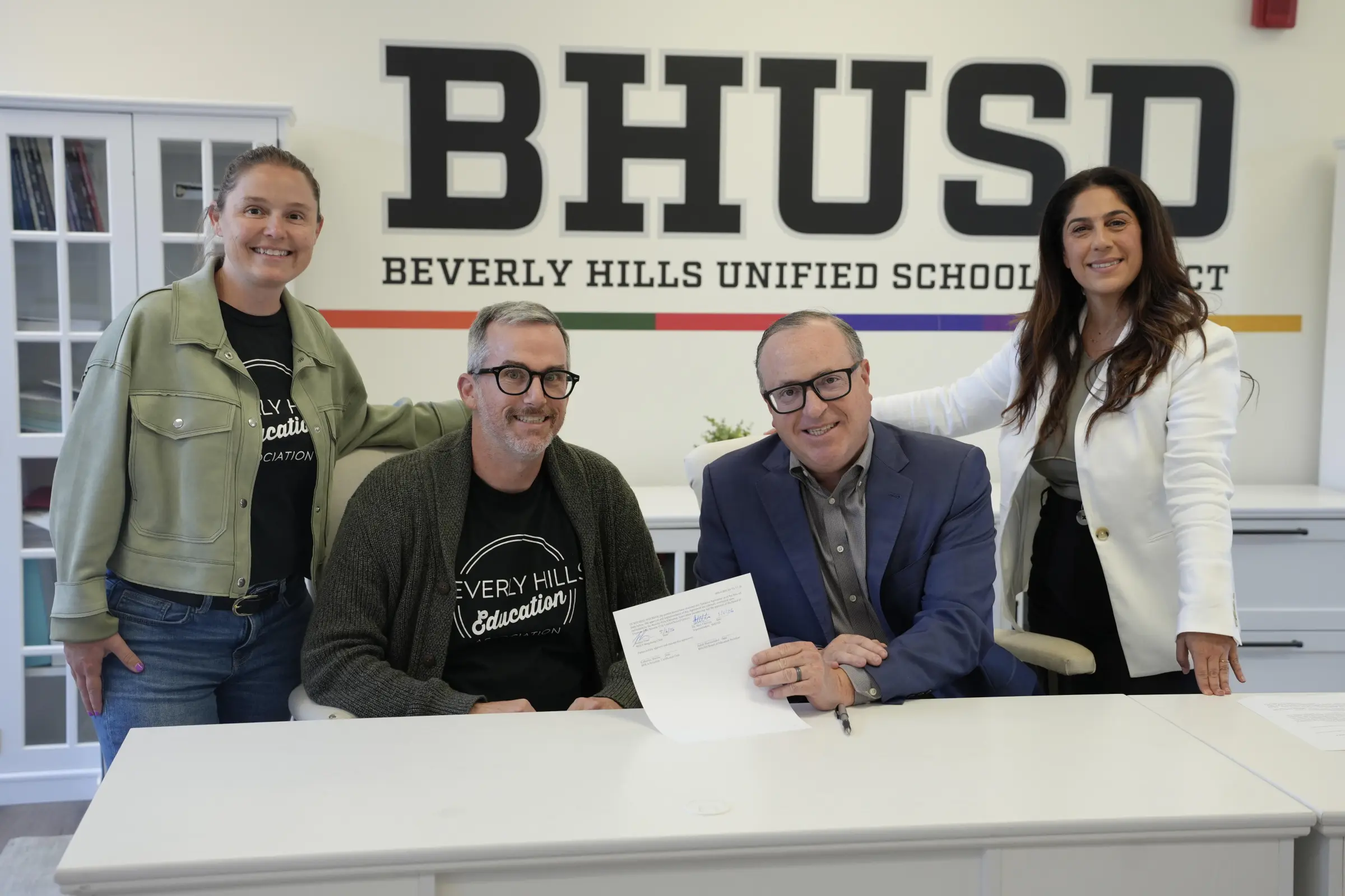 BHUSD Superintendent Dr. Alex Cherniss, Board President Judith Manouchehri, BHEA President Katherine Warren and BHEA Bargaining Chair Joshua Glass mark a tentative 2026-27 agreement.