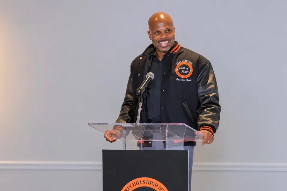 Brandon Nash addresses guests from the podium after being honored at BHAAA's Oct. 3 Hall of Fame dinner. Nash was Beverly High's 1997 Athlete of the Year and earned All-Pac-10 football honors at the University of Arizona.