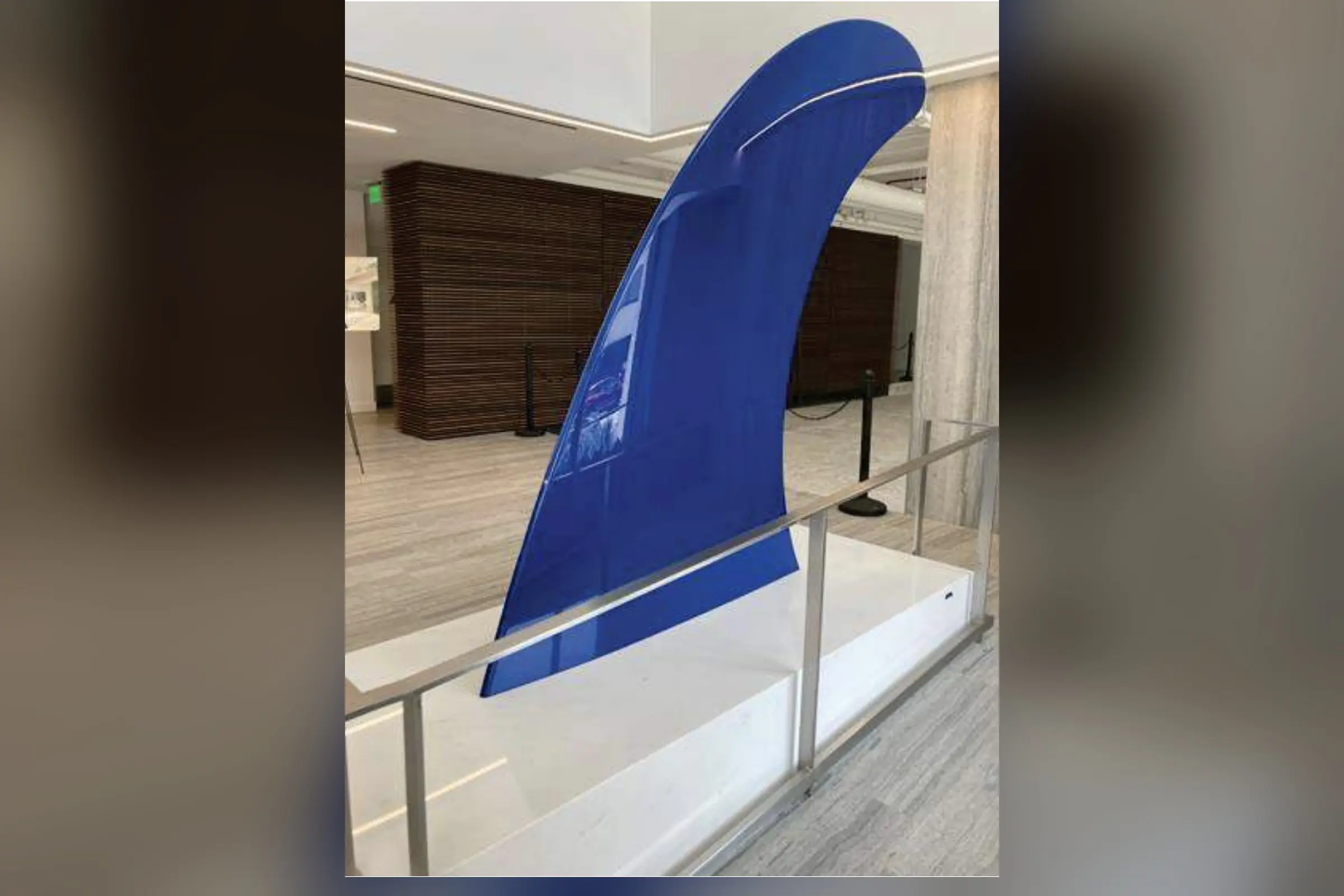 Cobalt-blue painted aluminum sculpture Fin by Alex Israel installed in the interior at 136 El Camino, Beverly Hills.