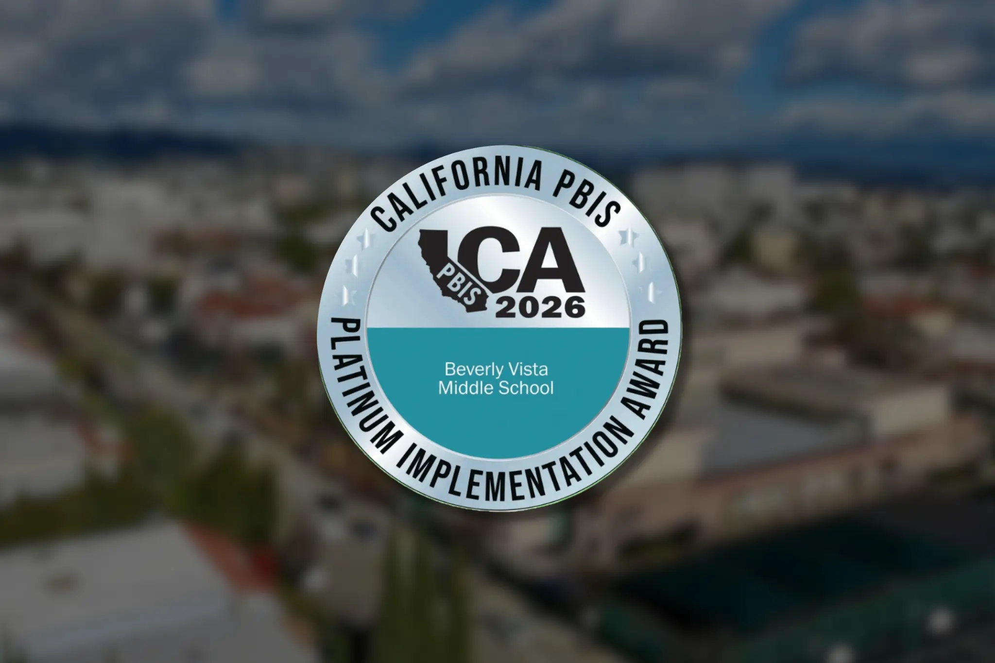 Beverly Vista Middle School's 2026 California PBIS Platinum Implementation Award badge over a blurred aerial campus image.