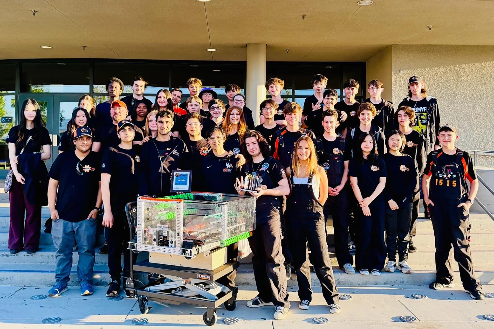 Members of Beverly Hills High School’s MorTorq Robotics Team pose with their robot after reaching the finals and finishing second at the FIRST Robotics California District Aerospace Valley Event in Lancaster.