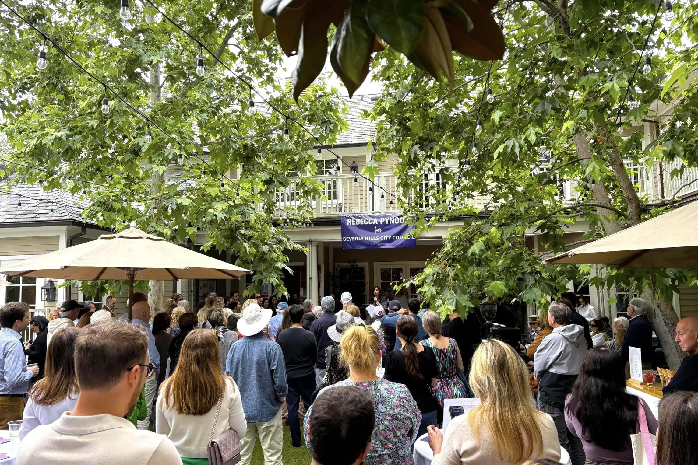 Supporters gather at Rebecca Pynoos’ Beverly Hills City Council campaign kickoff as she addresses the crowd.