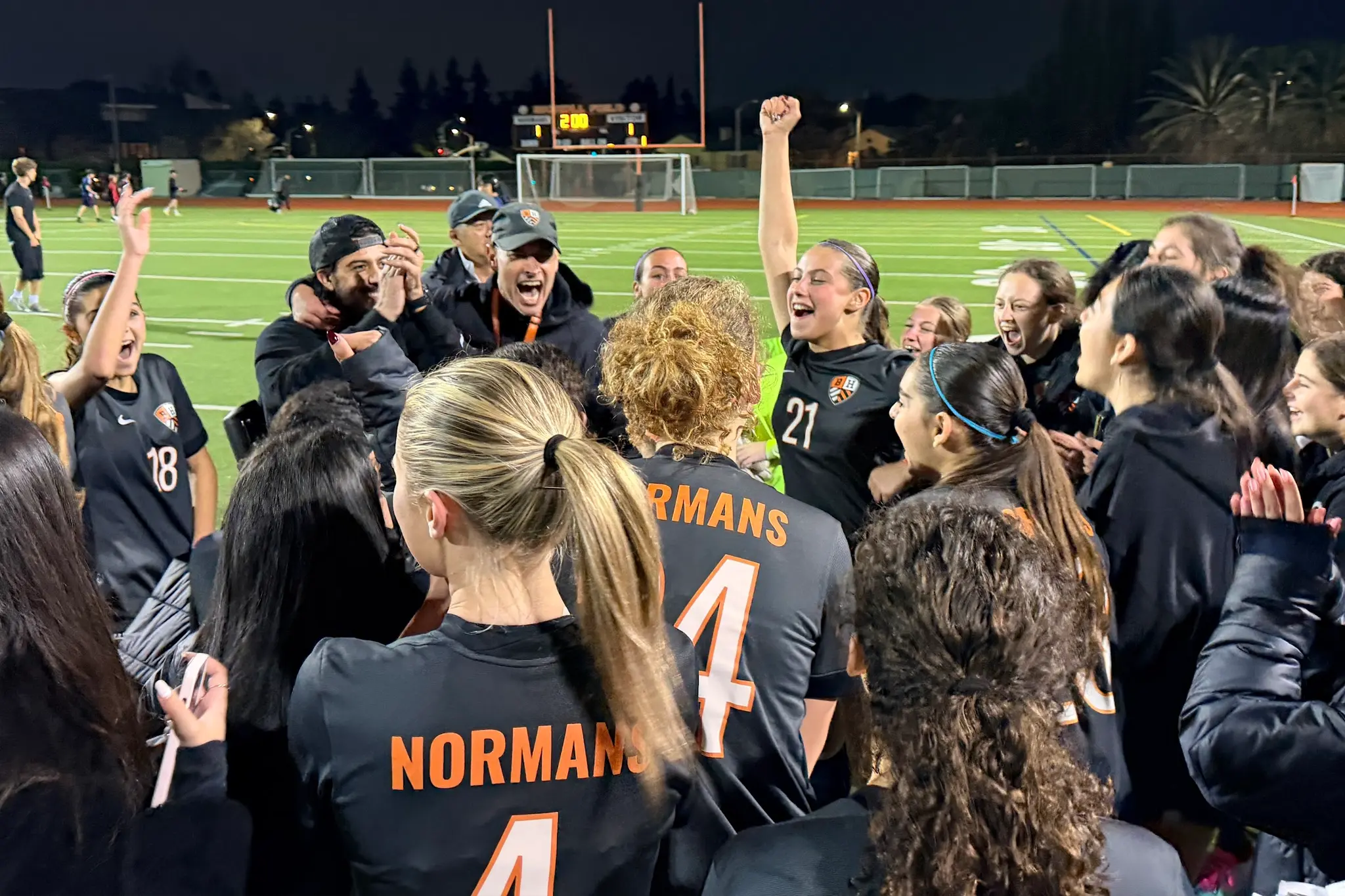 The Beverly Hills High School girls soccer team celebrates on the field following its CIF Southern Section playoff victory.