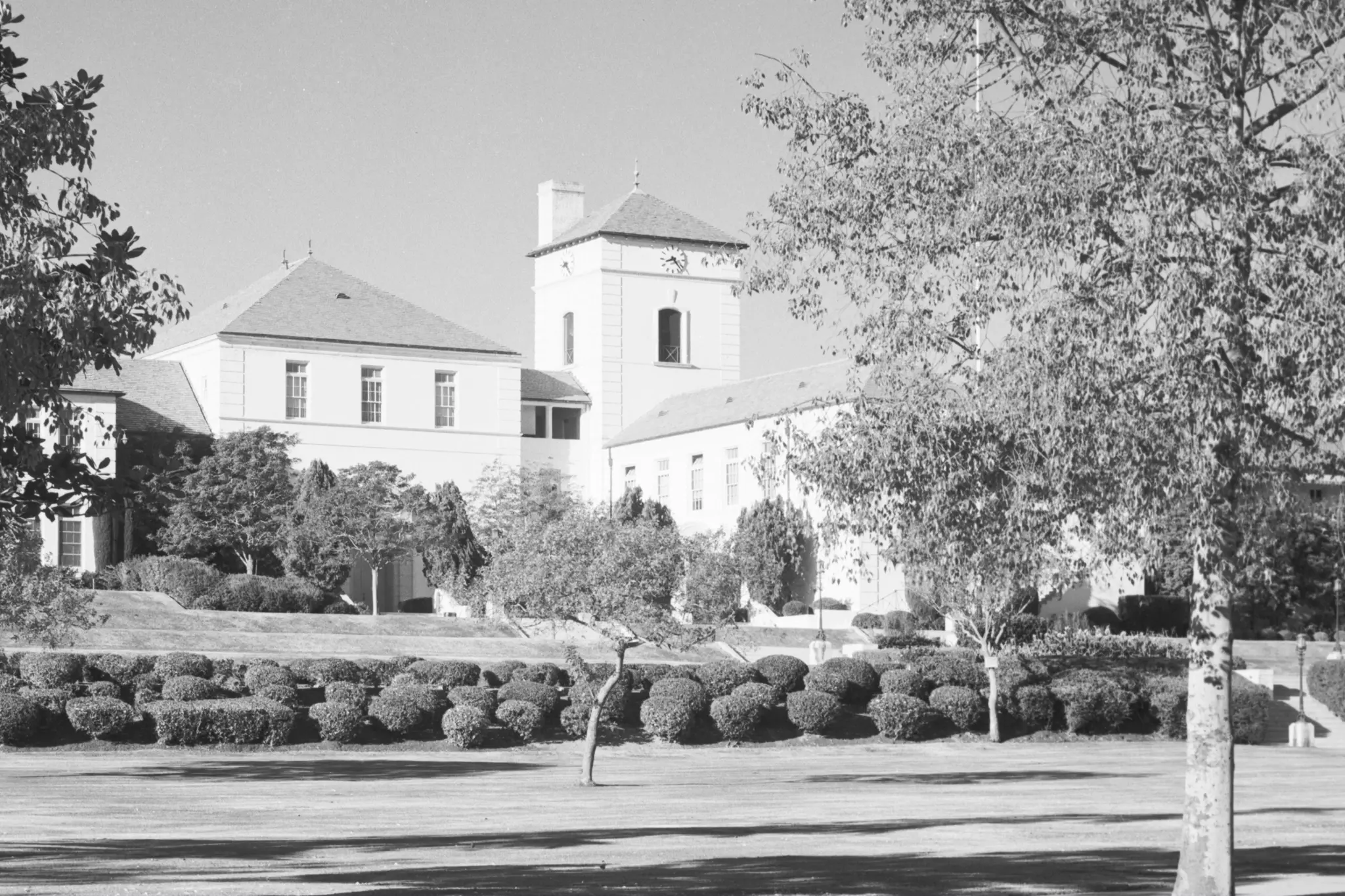 The Grand Lawn at Beverly Hills High School, seen here in the mid-1950s, with the campus watchtower rising behind the front campus landscape.