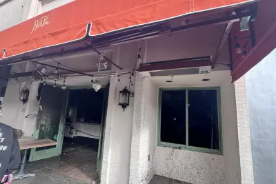 Fire-damaged interior of Porta Via in Beverly Hills after a Christmas morning blaze, showing extensive structural and interior destruction