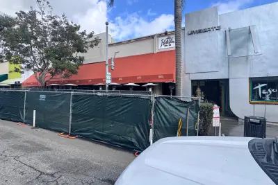 Fire-damaged interior of Porta Via in Beverly Hills after a Christmas morning blaze, showing extensive structural and interior destruction