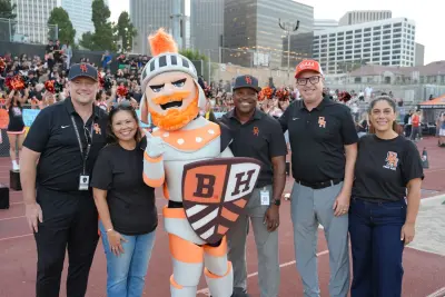 Four touchdowns, student leadership and renewed community belief mark Coach Jeff Bailey’s home debut. Left to right: Russell Stuart, Loan Sriruksa, Norman Mascot, Dr. Issaic Gates, Dr. Alex Cherniss, Judy Manouchehri